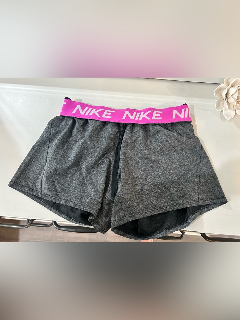 Nike Women's Gray Athletic Shorts with Pink Logo Waistband
